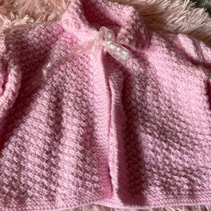 Set of handmade sweaters for baby girl